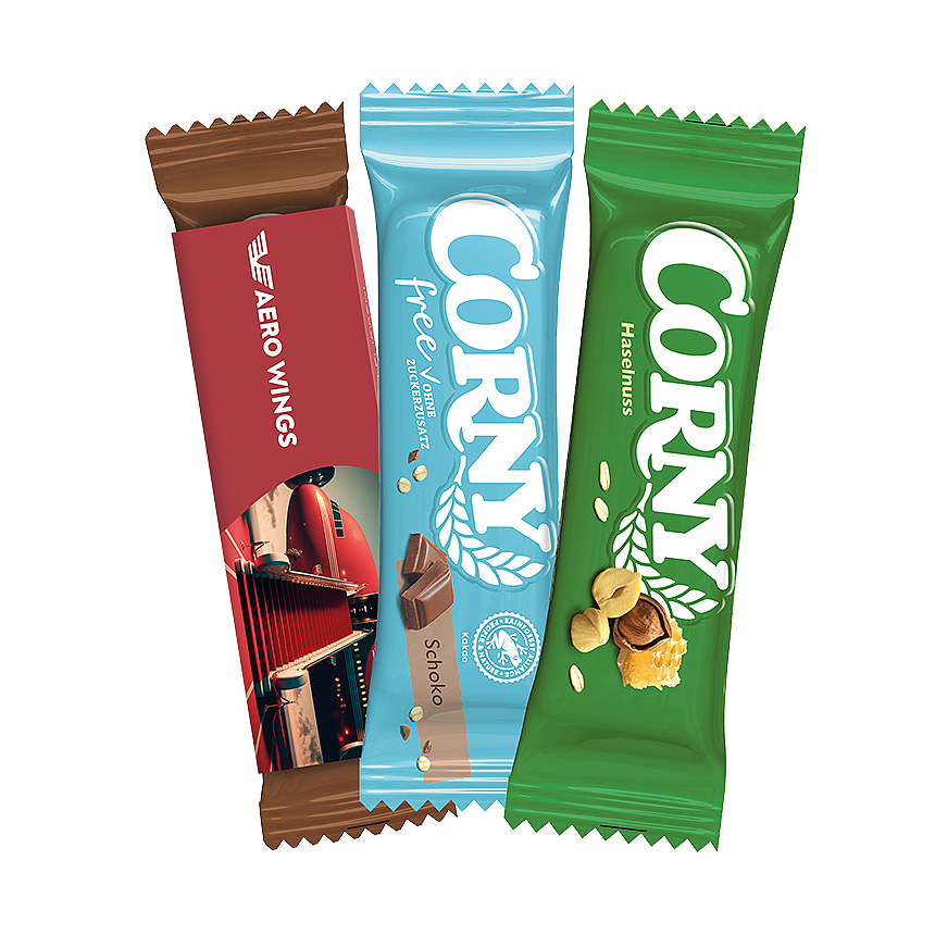 Corny cereální tyčinka, bílé lepenkové reklamní pouzdro, ořech - foto Corny cereální tyčinka, bílé lepenkové reklamní pouzdro, ořech - foto