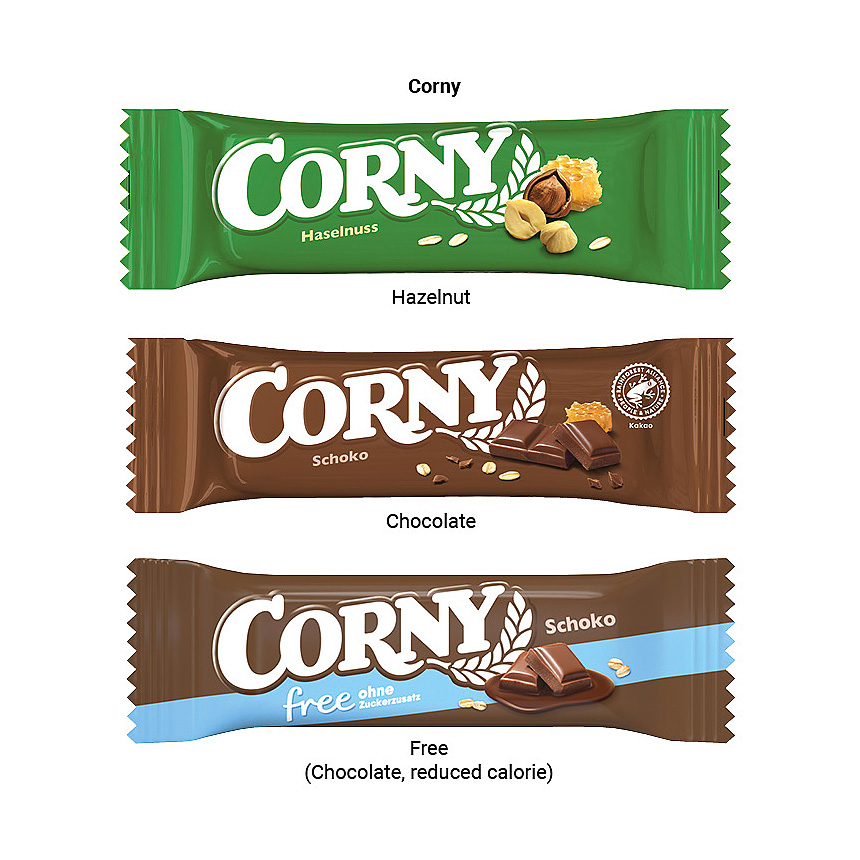 Corny cereální tyčinka, bílé lepenkové reklamní pouzdro, ořech - foto Corny cereální tyčinka, bílé lepenkové reklamní pouzdro, ořech - foto