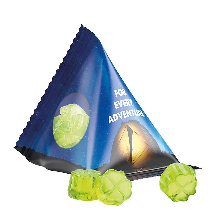 Jelly gums tetrahedron, foil transparent, Trolli fruit jelly gums clover leaf transparentní - foto Trolli fruit jelly gums in a tetrahedron, transparent foil, individually printed. Content: Trolli fruit jelly gums clover leaf green, in premium quality with… transparentní - foto
