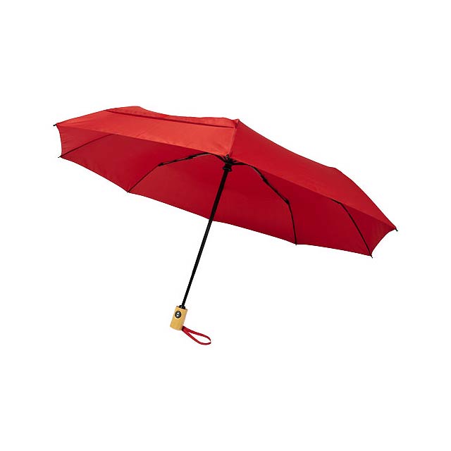 Deštník s automatickým otevíráním a skládáním s polyesterovou kupolí z recyklovaného PET ponžé. Odolná kovová tyčka, vysoce kvalitní rám s laminátovými žebry, které nabízí maximální flexibilitu ve větrných podmínkách. Dodává se v sáčku a lze jej snadno umístit do tašky nebo batohu pro pohodlné nošení. Společně s dřevěnou rukojetí a kupolí z recyklovaného PET polyesteru ponžé nabízí udržitelnou volbu. K dispozici v široké řadě moderních barev s velkou ozdobnou plochou na každém z panelů.  - transparentní červená - foto